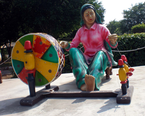 Punjabi Lady Spinning Yarn Charkha Statue